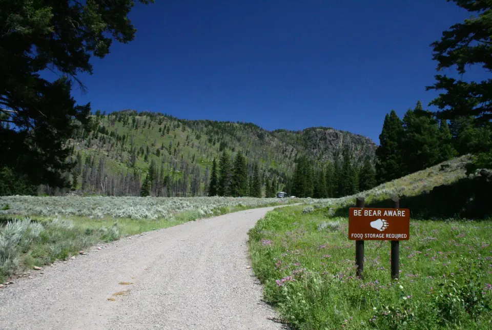 Slough Creek Campground "Be Bear Aware" reminder sign on the campground entrance road.