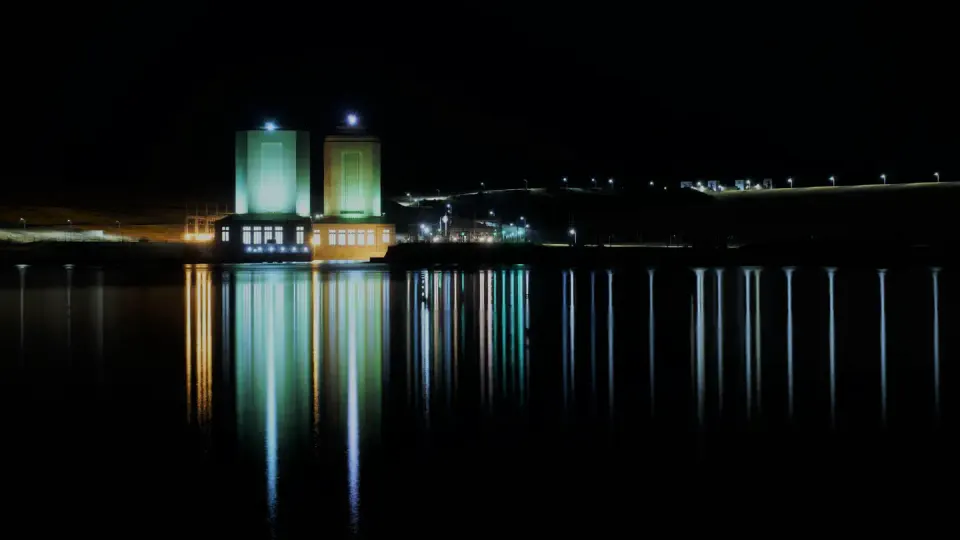A view of the power houses at night.