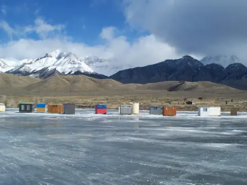 Ice fishing huts on the reservoir.