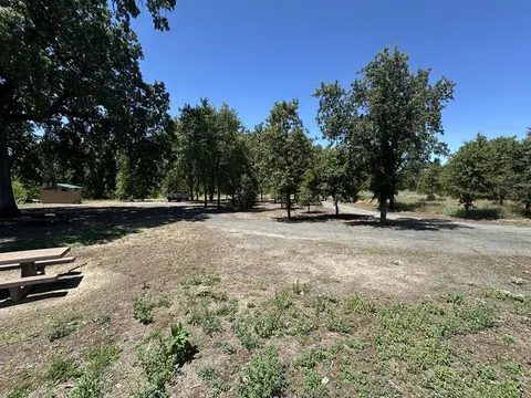 Parking area/driving loop, toilet, and edge of camping area
